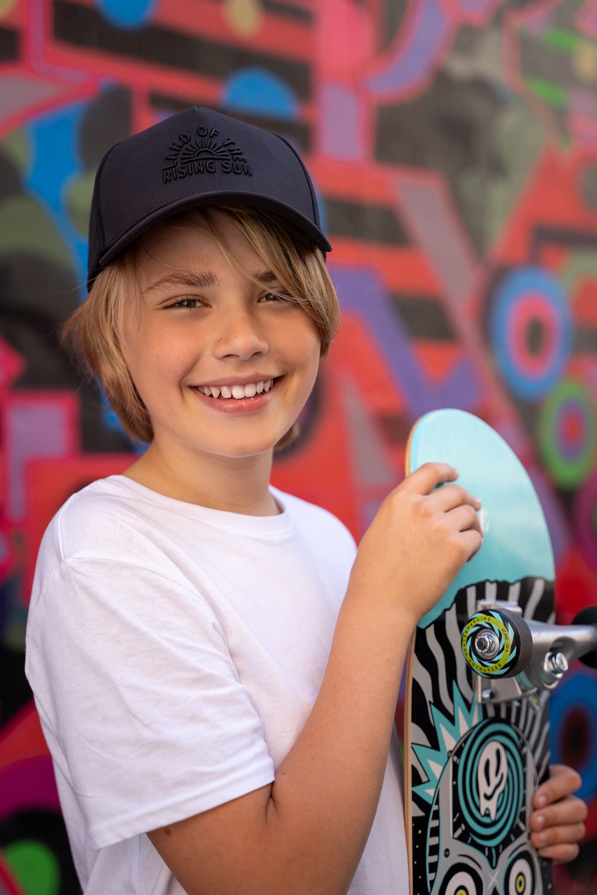Professional model test featuring a teenager sport fashion model in natural light with skateboard