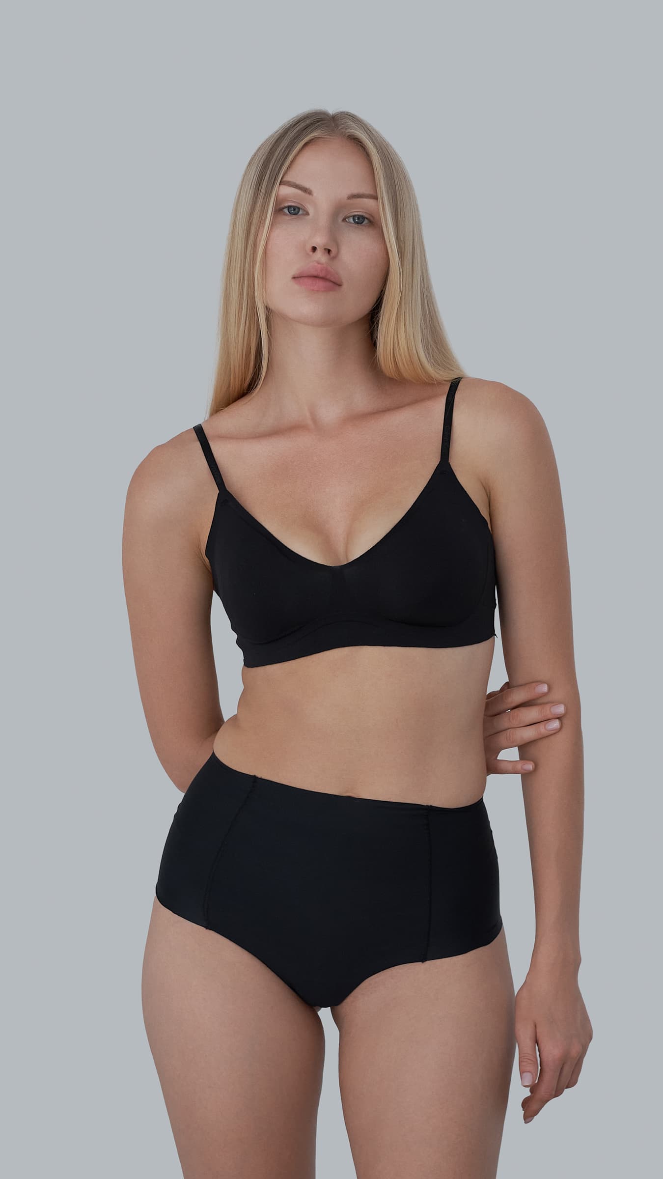 Professional model digitals featuring a female fashion model with natural makeup and clean styling in a New York photo studio.