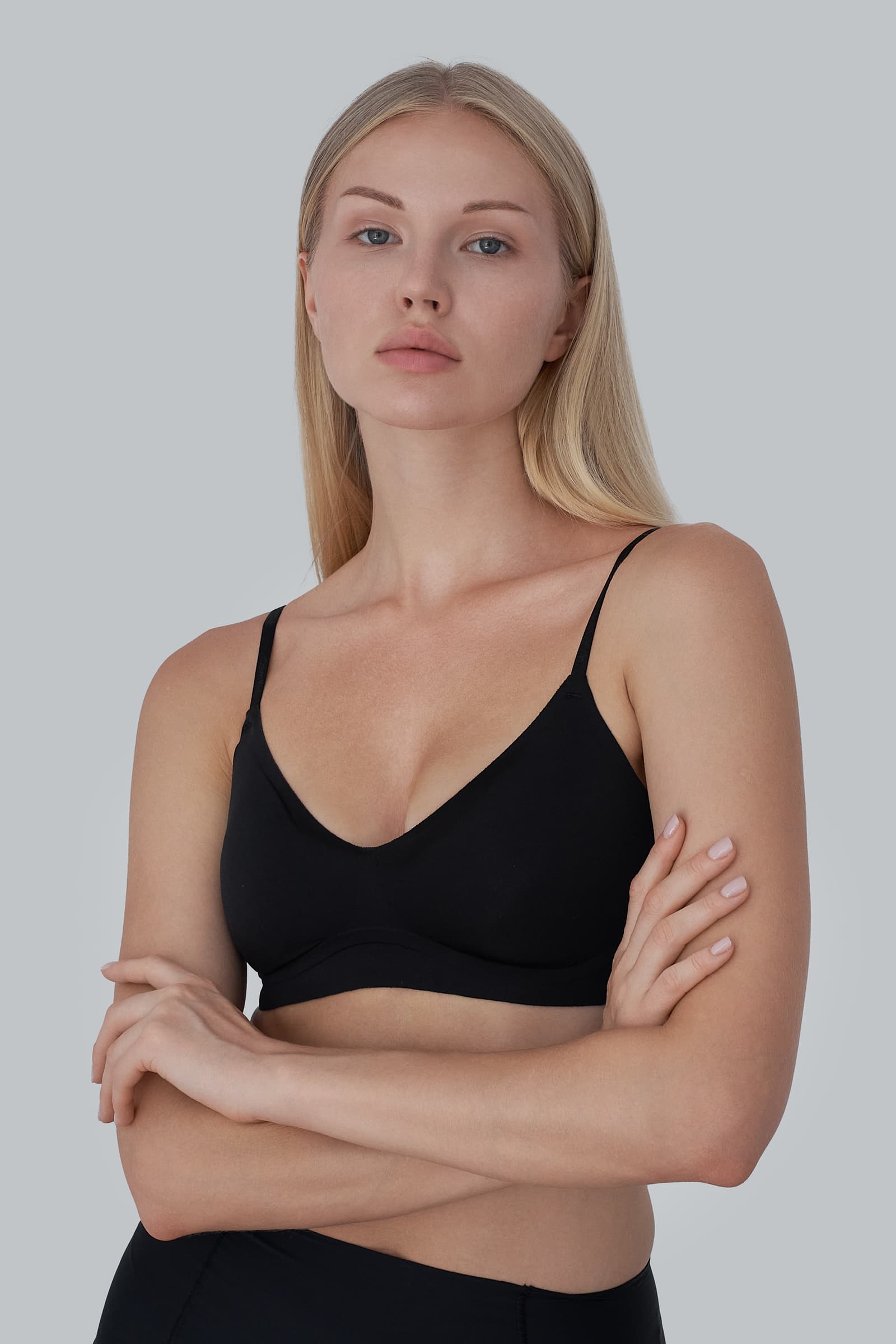 Professional model digitals featuring a female fashion model with natural makeup and clean styling in a New York photo studio.
